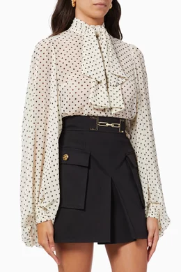 Bodysuit-style blouse with polka dot print and bow