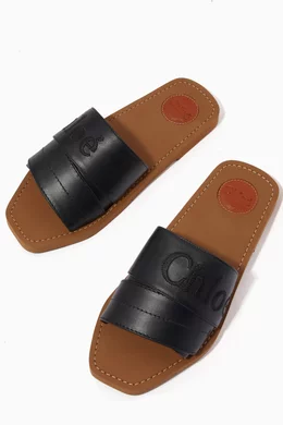 Buy Chloé Black Woody Logo Slide Sandals in Calfskin for Women