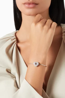 Buy Swarovski Blue Hyperbola Heart Crystal Bangle in Rhodium