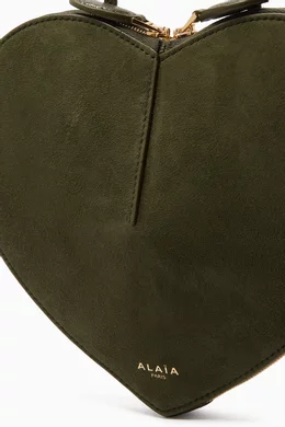 Buy Alaïa Green Le Coeur Crossbody Bag in Suede for Women Online - Main Image