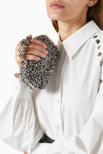 Skull Embellished Four-ring Clutch in Leather