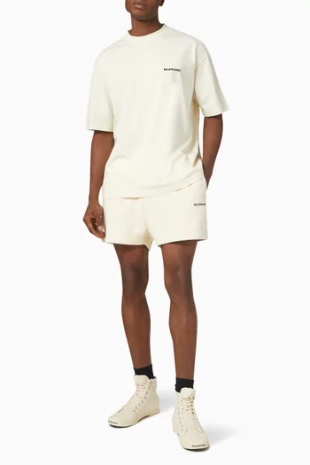 تي شيرت جيرسيه بلون باهت بشعار الماركة