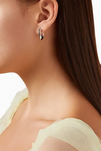 Signature C Huggie Earrings in Metal