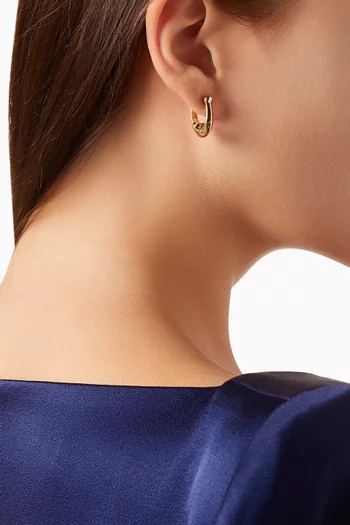 Signature C Huggie Earrings in Metal