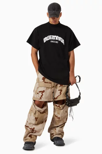 تي شيرت فضفاض بشعار الماركة بتصميم مقلوب جيرسيه كلاسيكي للجنسين