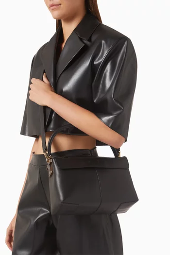 حقيبة بوليتو صغيرة بحلية حرف T وبيد علوية جلد