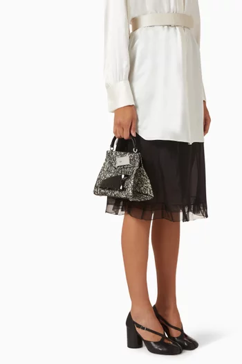 حقيبة سناتشد صغيرة بيد علوية جلد