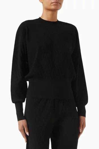 سترة بأساور عريضة منسوجة بغرزة الضفيرة