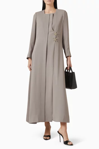 عباية بأزرار على شكل نجمة البحر