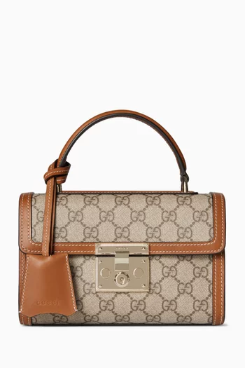 حقيبة صغيرة بقفل ويد علوية قماش مغلف بشعار GG