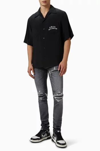 Distressed Skinny Jeans in Stretch Denim