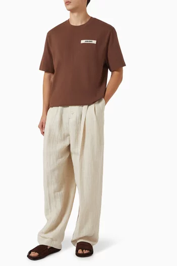 تي شيرت بشعار الماركة من نسيج مضلع قطن