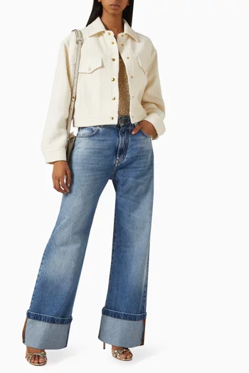 بنطال جينز واندا بقصة ساق واسعة وحواف مطوية دينم