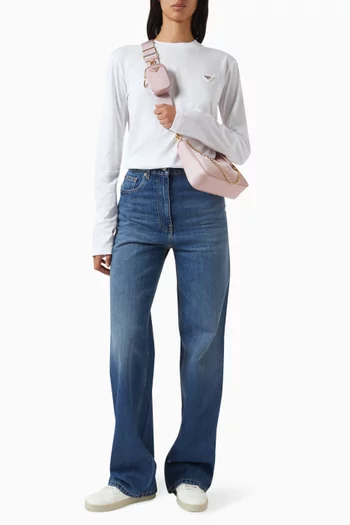 تي شيرت بشعار الماركة وتفاصيل ممزقة قطن وجيرسيه