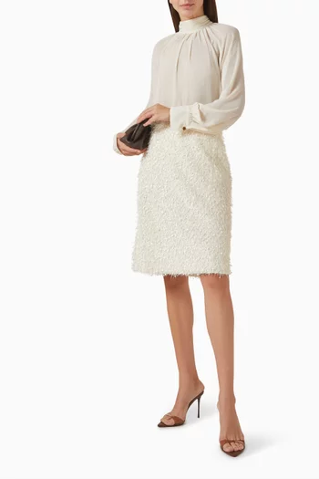 تنورة بشرّابات من الريش