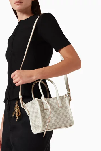 حقيبة بيد علوية ونقشة شعار الماركة