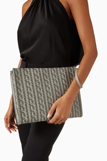 Cady Monogram Clutch in Vegan Leather