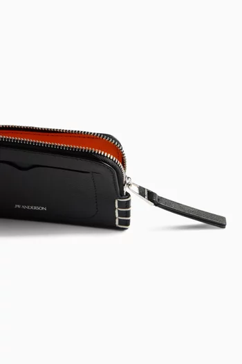 محفظة بسحّاب وحياكة مستوحاة من الأحذية سهلة الارتداء جلد