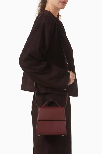 حقيبة صغيرة بيد علوية جلد