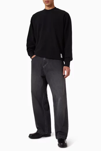 بنطال بقصة فضفاضة بلون باهت دينم