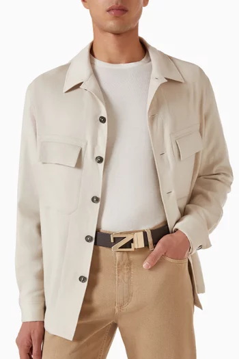 حزام بوجهين وشعار الماركة جلد