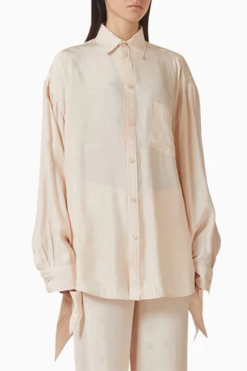 بلوزة بأساور بعقدة ونقشة شعار الماركة