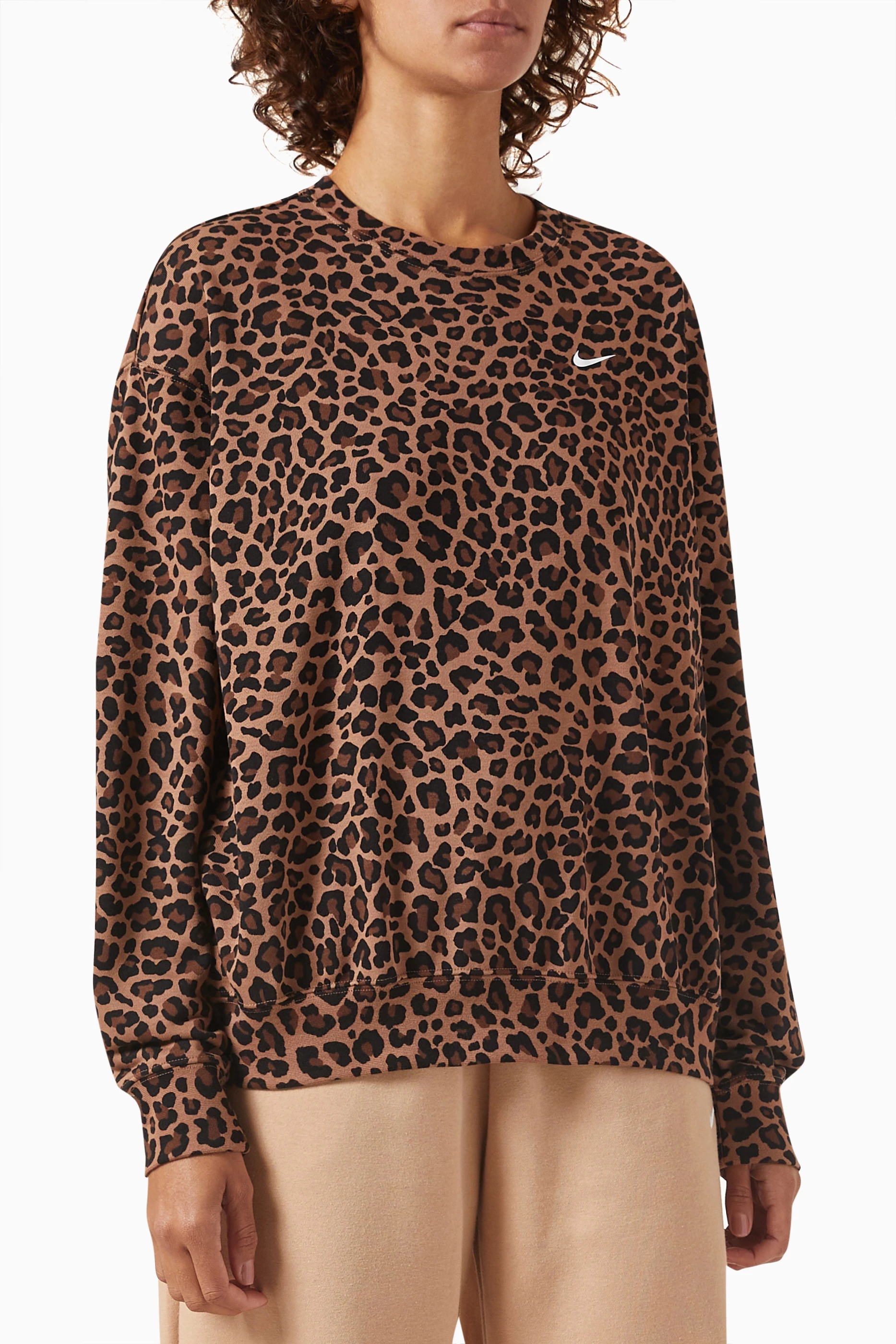Buy Nike Brown Nike Dri FIT Get Fit Leopard Sweatshirt in Jersey