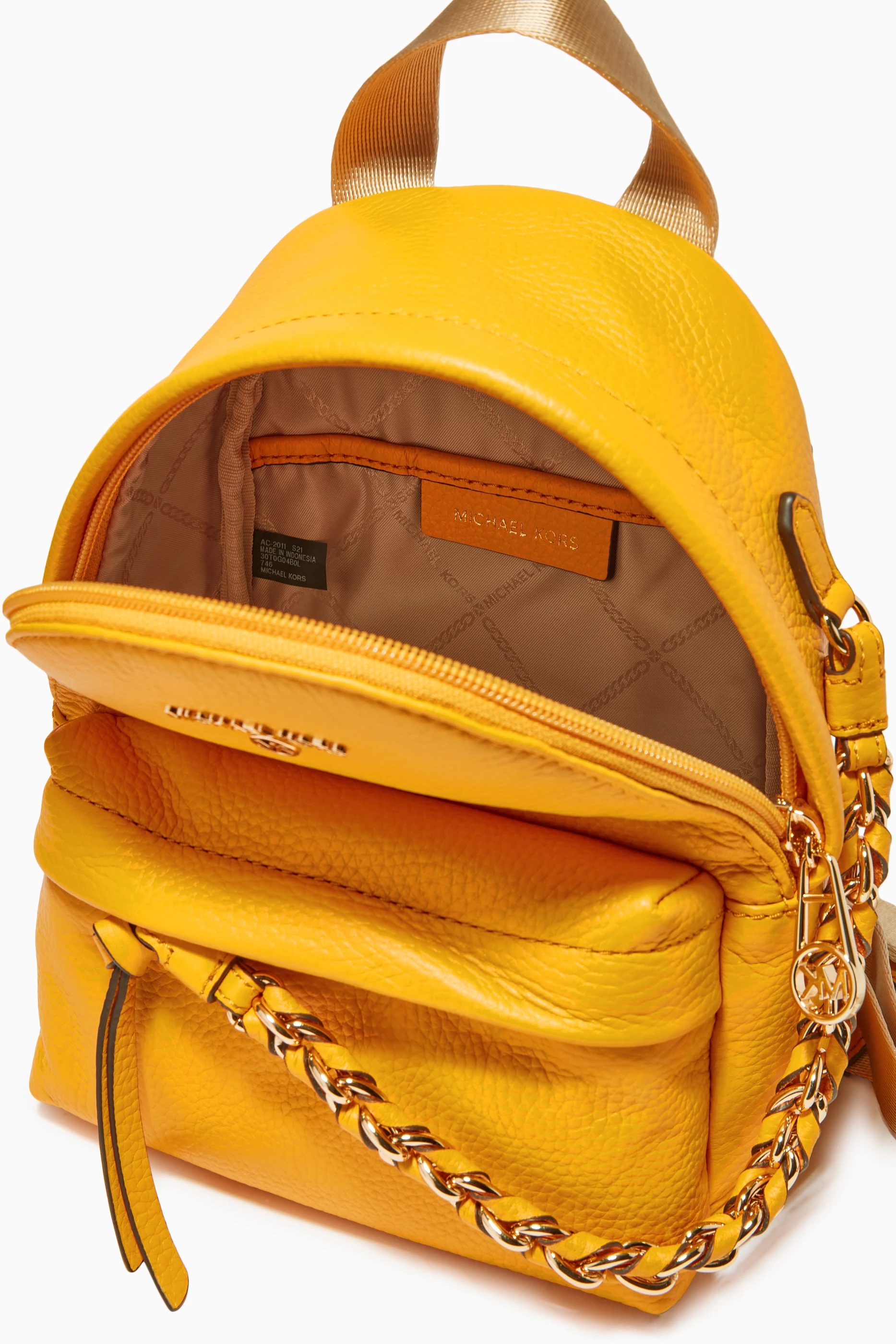 Buy Michael Kors Orange Extra Small Slater Backpack in 