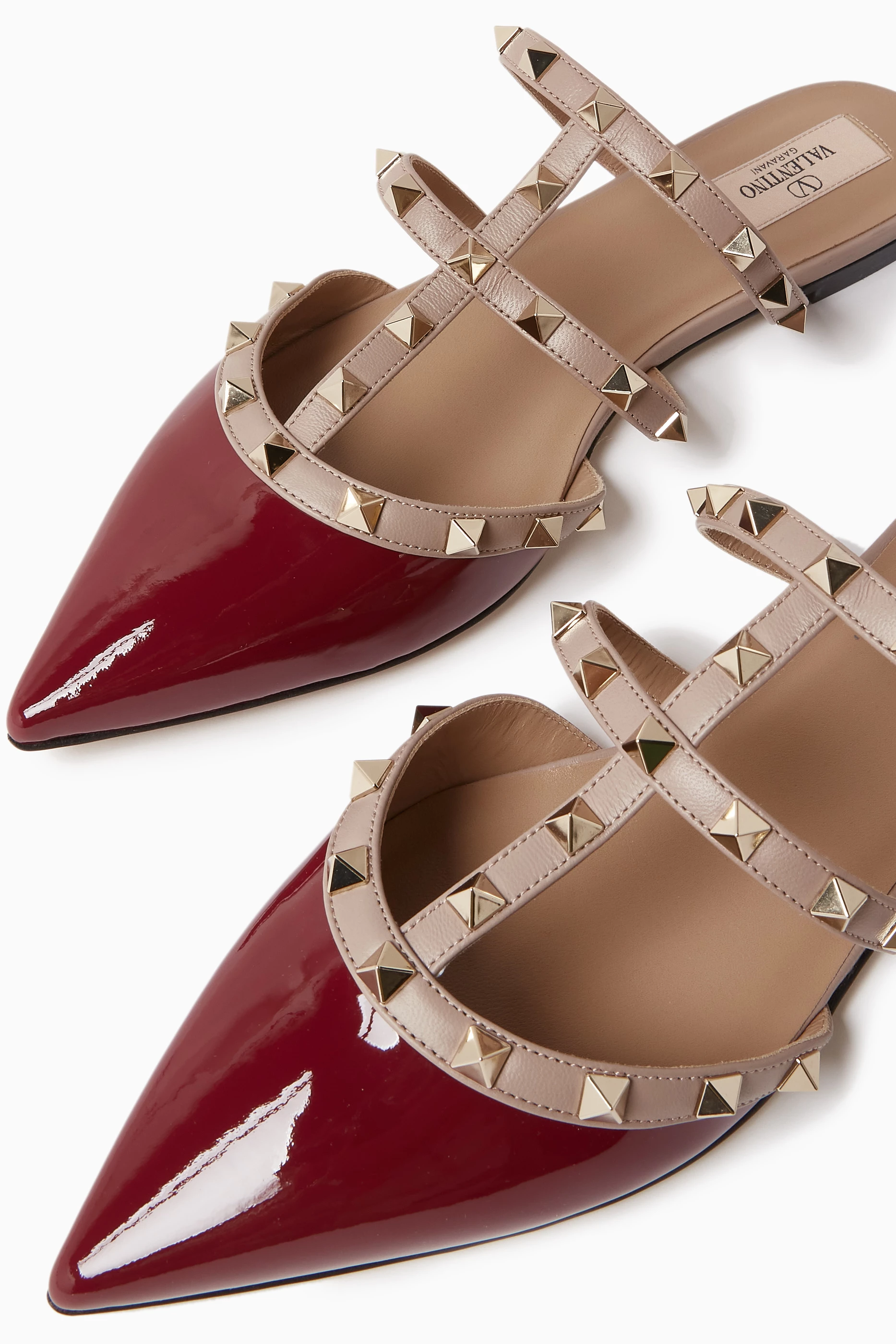 Buy Valentino Garavani Red Valentino Garavani Rockstud Flat Mules in Patent Leather for Women Online Ounass Kuwait