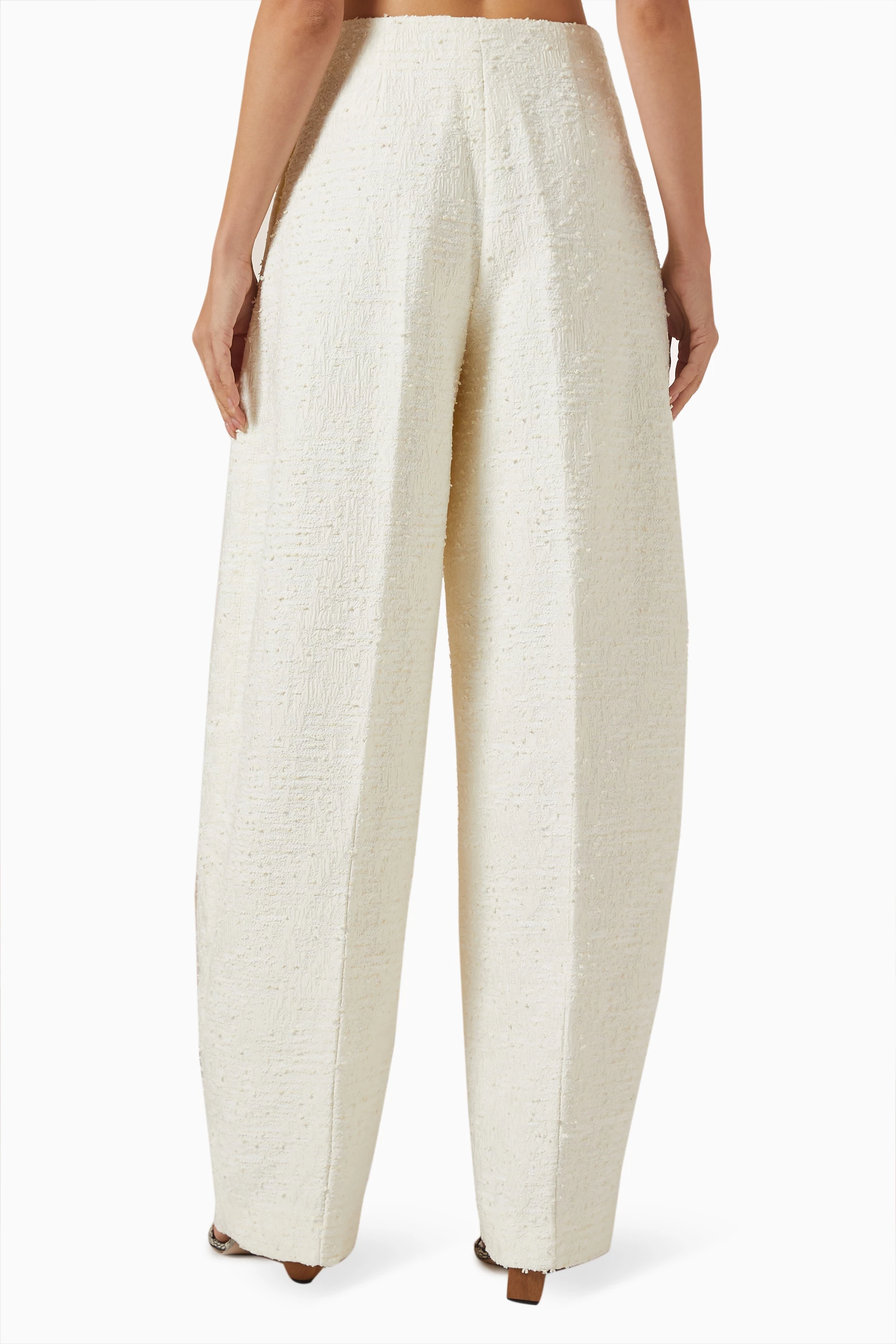 Buy Jacquemus Neutral Le Pantalon Curvo Pants in Tweed for Women